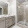 bathroom with shower and large window
