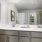 bathroom with sink and large mirror