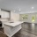 Kitchen with stainless steel appliances and dining room