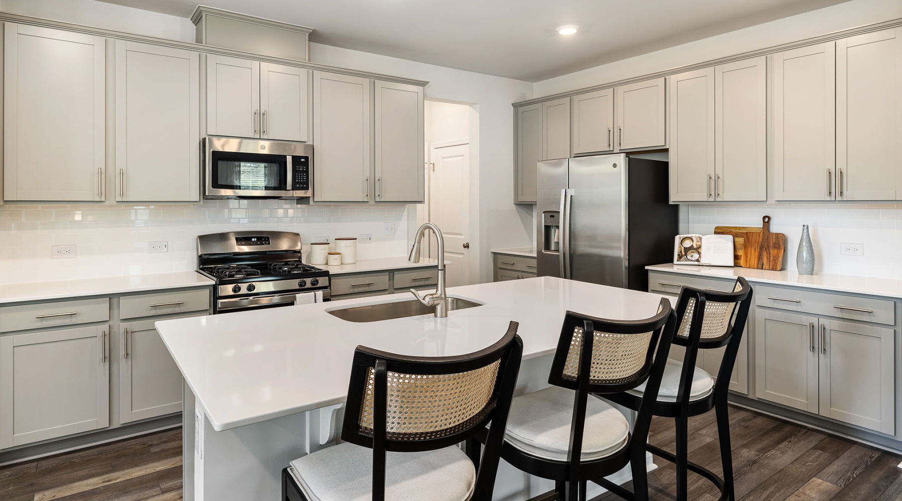 kitchen with large island and white cabinents