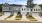 front of townhomes with grass and sidewalk