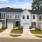 front of townhomes with grass and sidewalk