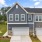 front of townhomes with grass and sidewalk