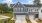 front of townhomes with grass and sidewalk