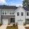 front of townhomes with grass and sidewalk