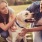 a couple petting a dog